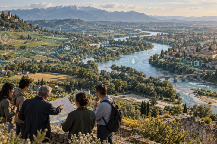 Persone consultano una mappa davanti a una valle fluviale: illustrazione della collaborazione nei Contratti di Fiume.